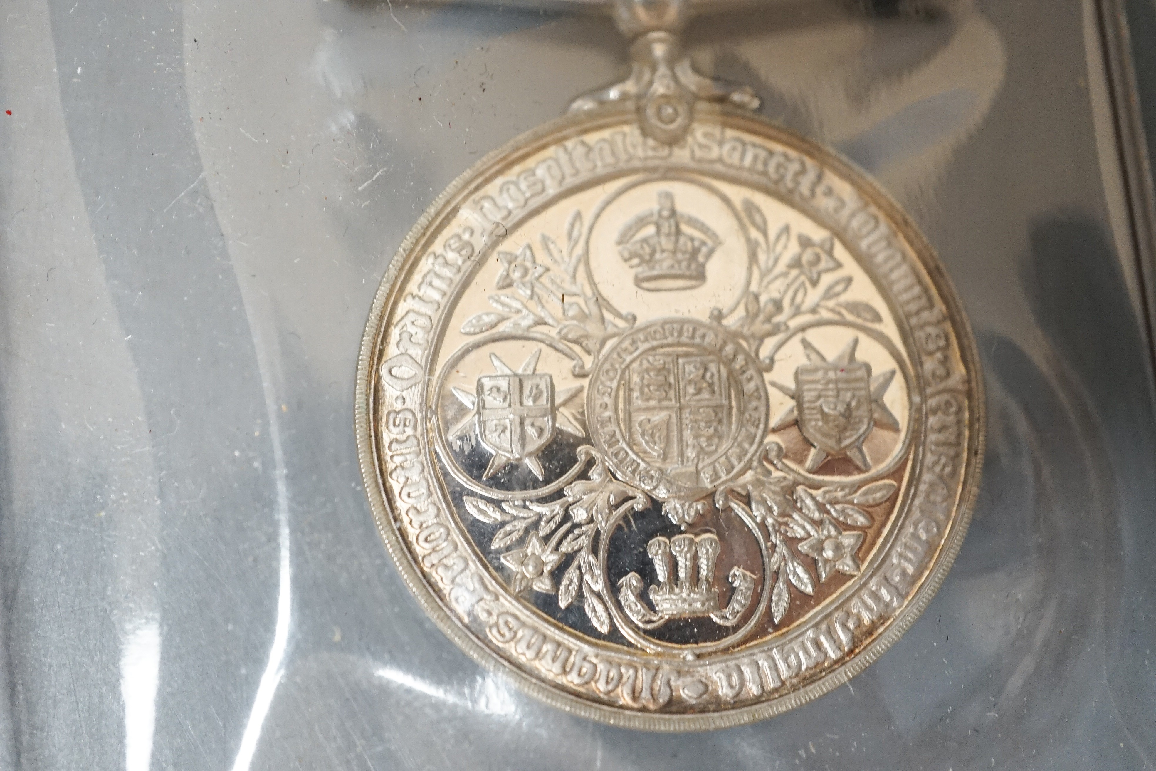 Three Imperial Service medals to Edward James Parker, William Horsfield and Albert Edward Ellis and two Service medals of the Order of St John to 13472 A/SIS.M.TIDMAN.BRISTOL.NO.1.NSG.DIV.NO.2DIS.JAB. 1935 and E692 SGT.